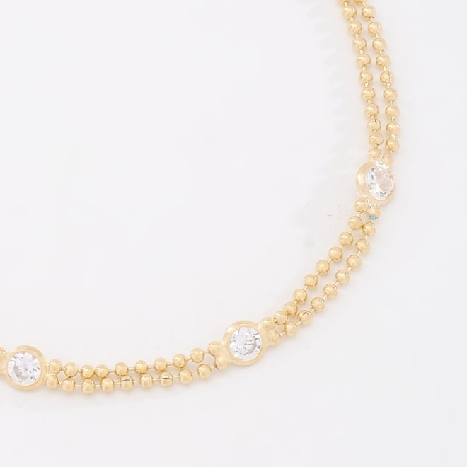 PU-00544 PULSEIRA BANHADA A OURO 18K COM CORRENTE DUPLA DE BOLINHAS E DETALHES PONTUAIS EM ZIRC&Ocirc;NIAS