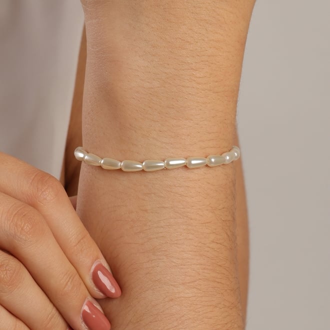 PU-00680 PULSEIRA BANHADA A OURO 18K COM P&Eacute;ROLAS EM FORMATO ALONGADO