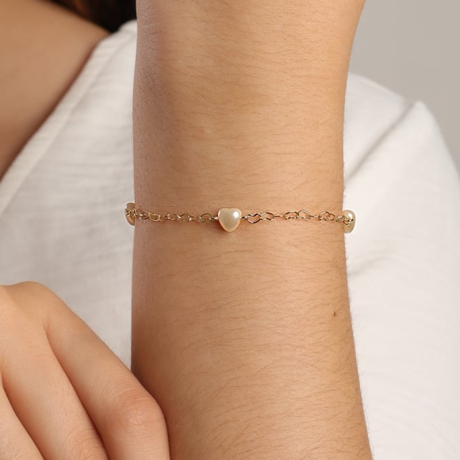 PU-00827 PULSEIRA COM DETALHES DE PÉROLAS EM FORMATO DE CORAÇÃO