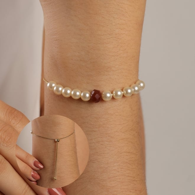 PU-00830 PULSEIRA COM PÉROLAS E DETALHE EM ESFERA MARROM