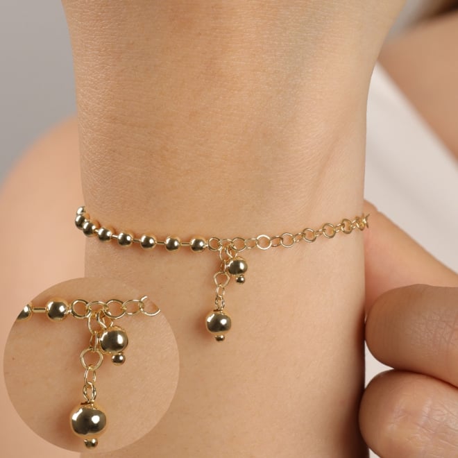 PU-00933 PULSEIRA BANHADA A OURO 18K COM ESFERAS  E DETALHE DE PINGENTE DELICADO