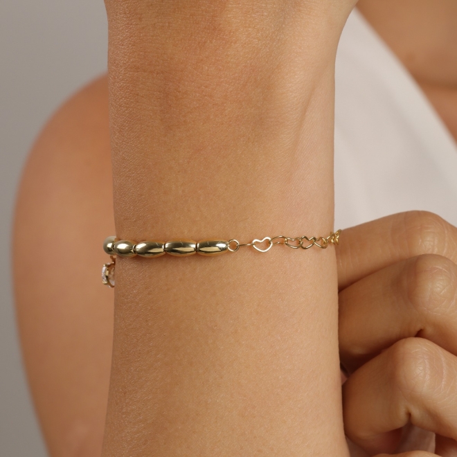 PU-01042- PULSEIRA BANHADA A OURO 18K COM ESFERAS POLIDAS DE CORAÇÃO COM ZIRCÔNIA