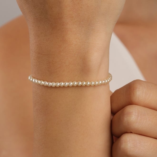PU-01050 PULSEIRA BANHADA A OURO 18K COM P&Eacute;ROLAS SINT&Eacute;TICAS