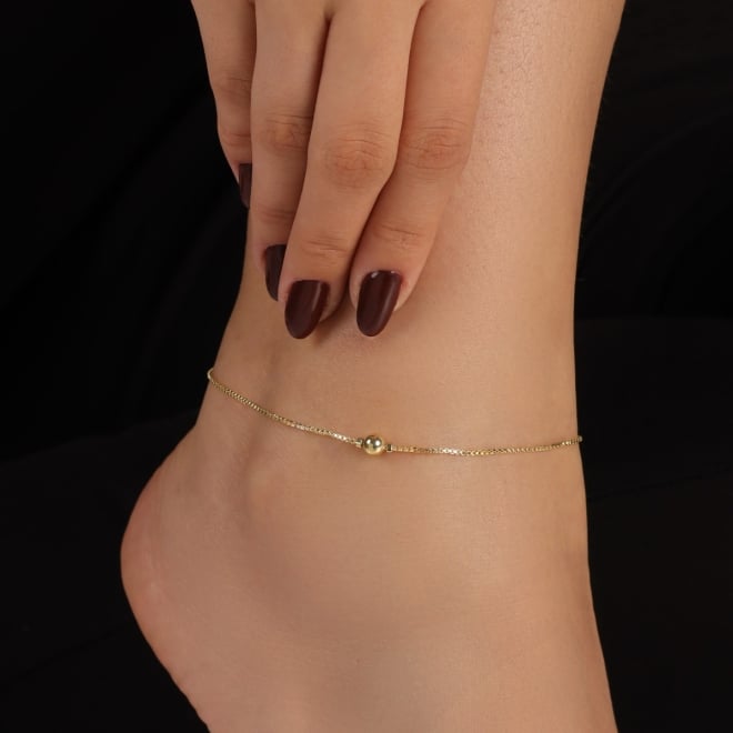 TN-00012 TORNOZELEIRA BANHADA A OURO 18K COM ESFERA LISA CENTRAL