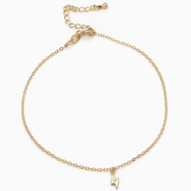 TN-00055 TORNOZELEIRA BANHADA A OURO 18K COM PINGENTE EM FORMATO DE RAIO