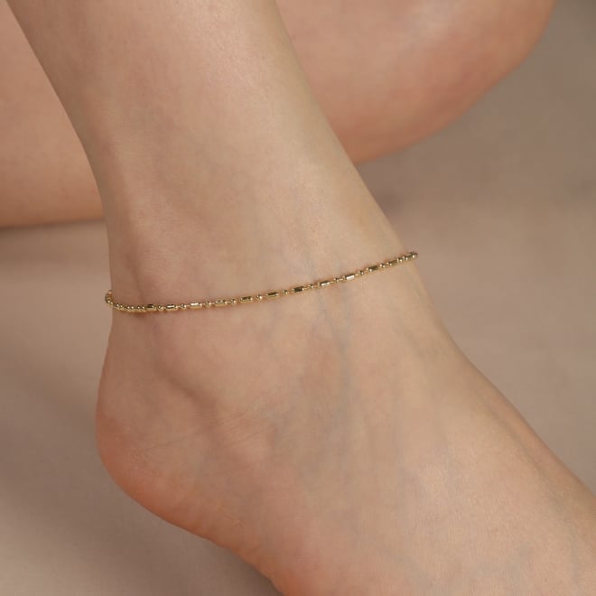 TN-00132 TORNOZELEIRA BANHADA A OURO 18K COM DETALHES EM ESFERAS