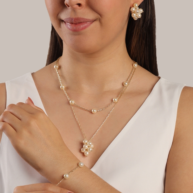 PU-00569 PULSEIRA BANHADA A OURO 18K COM PÉROLAS ESPAÇADAS NA CORRENTE