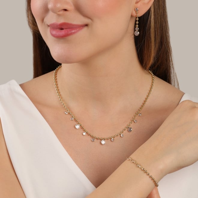 PU-00950 PULSEIRA BANHADA A OURO 18K COM DESIGN ASSIMÉTRICO DE ESFERAS E ZIRCÔNIAS