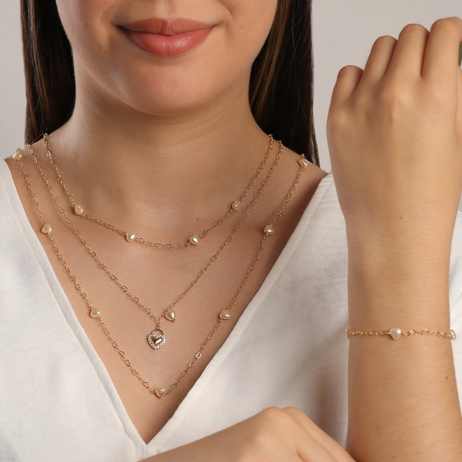 PU-00827 PULSEIRA COM DETALHES DE PÉROLAS EM FORMATO DE CORAÇÃO