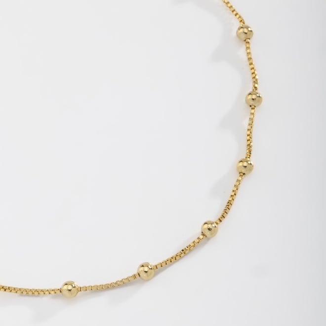 KPI-0017 PULSEIRA BANHADA A OURO 18K COM ESFERAS