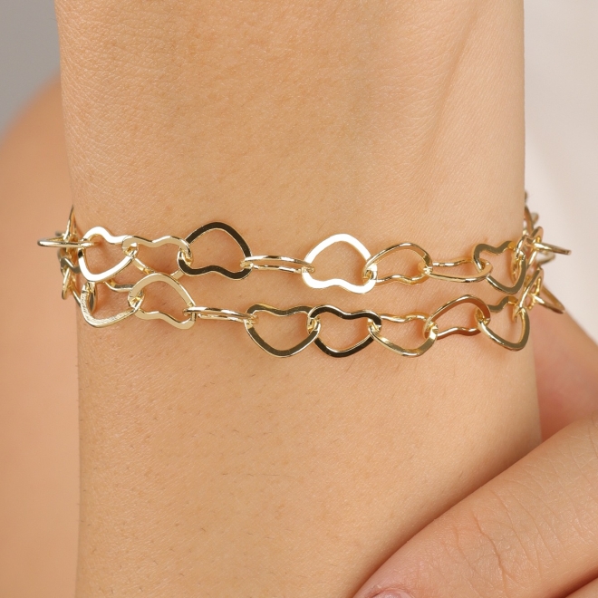 PU-00112 PULSEIRA COM ELOS ENTRELAÇADOS EM CORAÇÃO