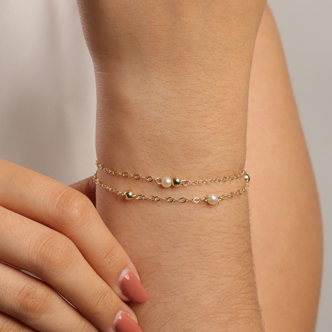PU-00592 PULSEIRA DUPLA COM ESFERAS POLIDAS E PÉROLAS