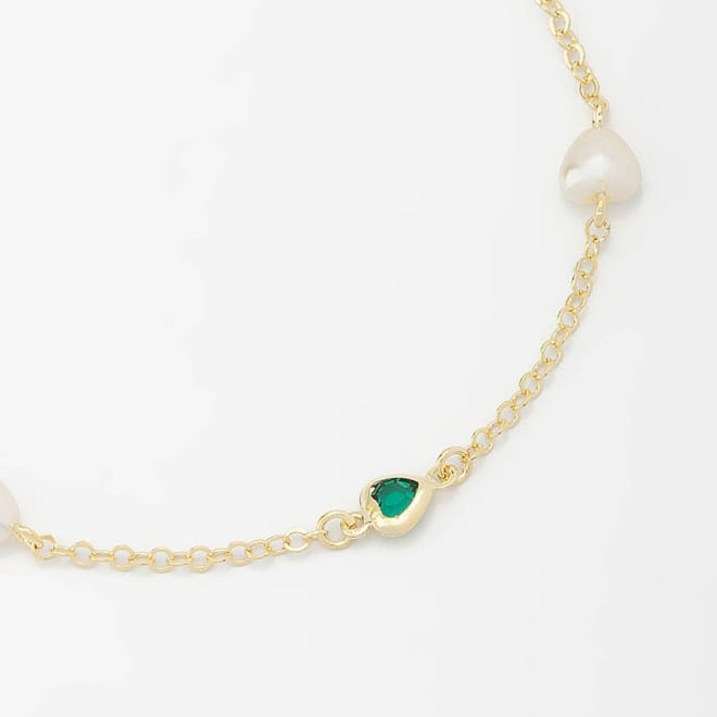 PU-00693 PULSEIRA COM DETALHES EM PÉROLAS E PEDRAS EM CORAÇÃO