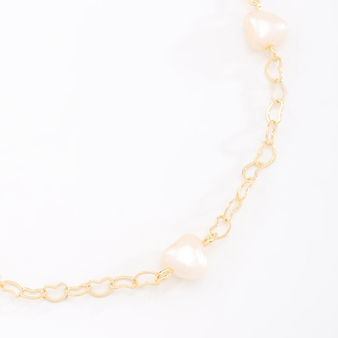 PU-00827 PULSEIRA COM DETALHES DE PÉROLAS EM FORMATO DE CORAÇÃO