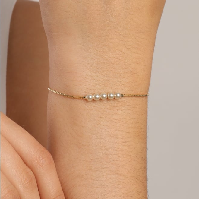 PU-00856 PULSEIRA AJUSTÁVEL COM DETALHES EM PÉROLAS