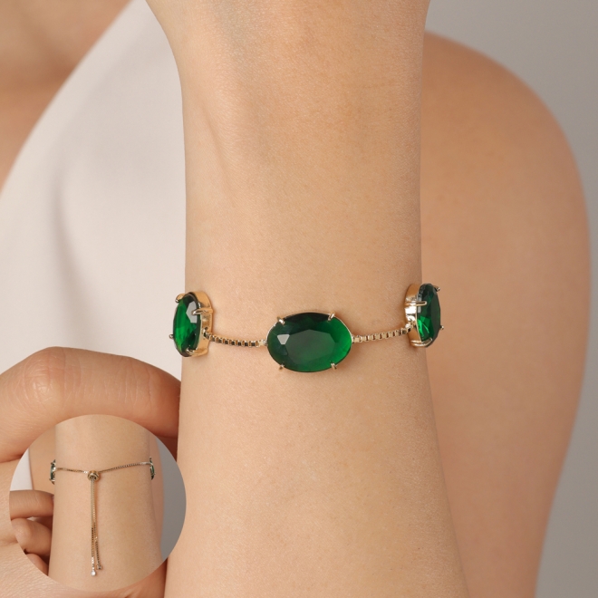 PU-00911 PULSEIRA BANHADA A OURO 18K COM TRÊS PEDRAS DE ZIRCÔNIA EM FORMATO OVAL E FECHO AJUSTÁVEL